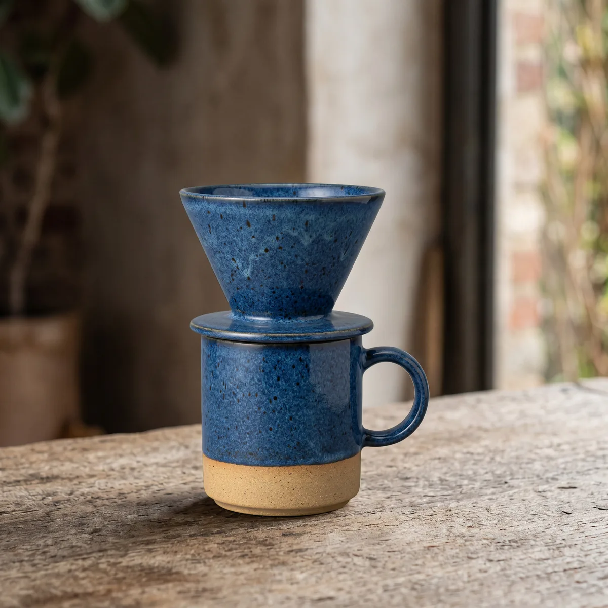 The mug on a stone counter by a soft-lit wall